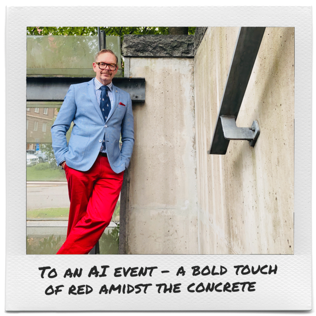 En man i färgglada kläder vid en betongvägg. En man i färgglada kläder.