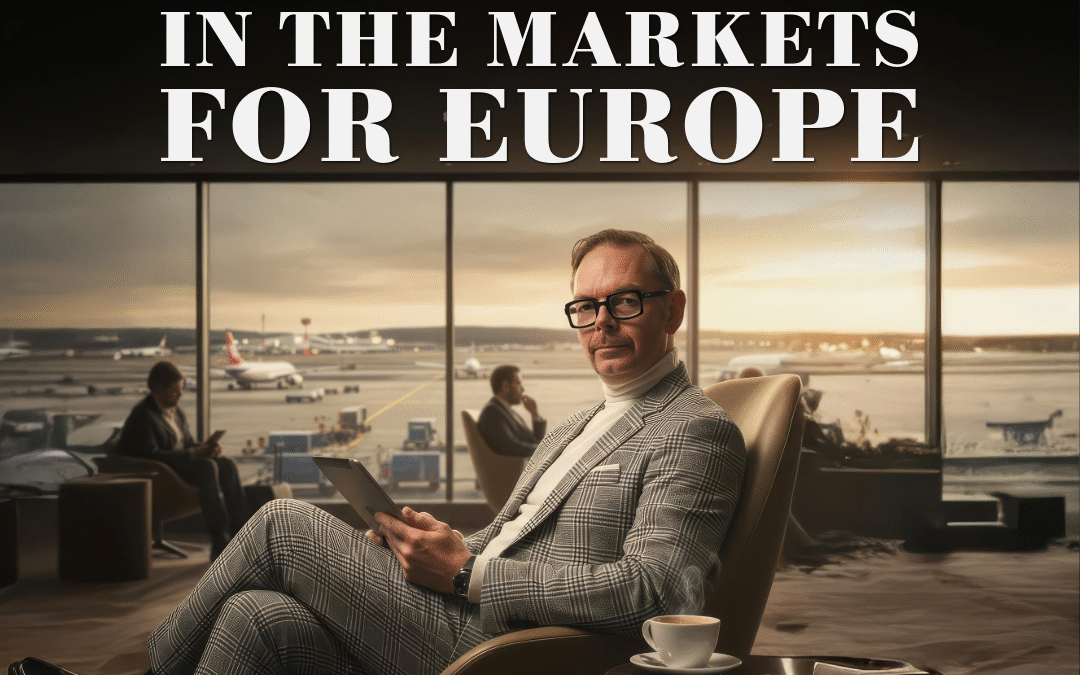 En man i kostym sitter med en surfplatta i en loungemiljö med fönster som visar en flygplats.